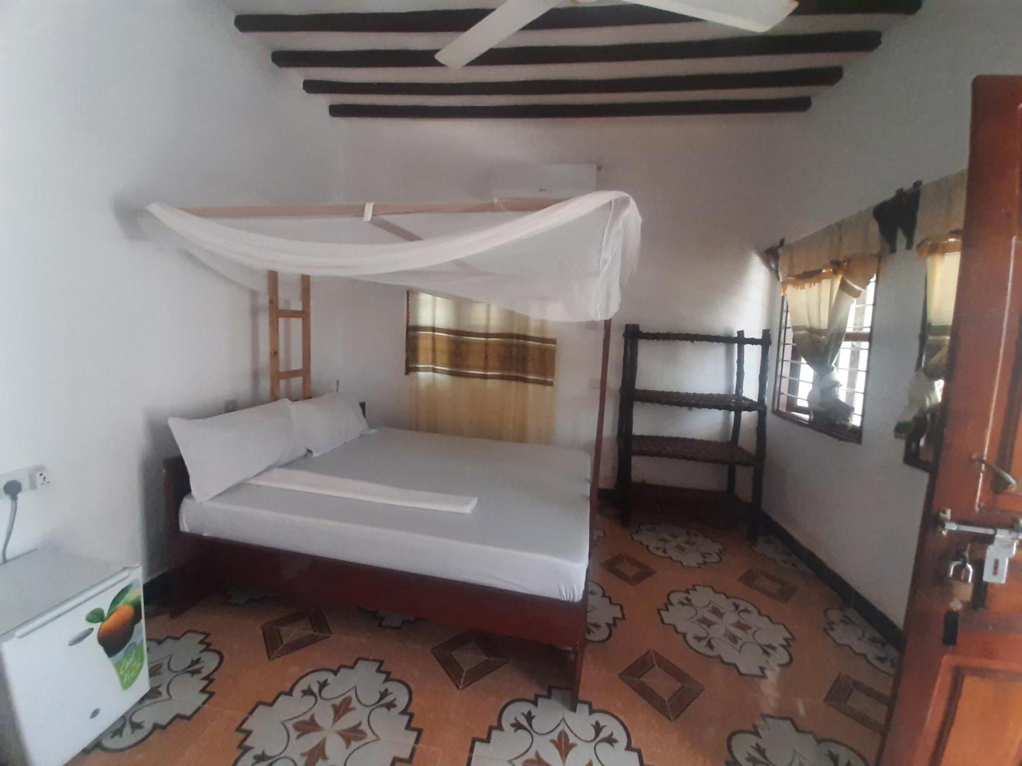 Ames Nungwi Quarto foto