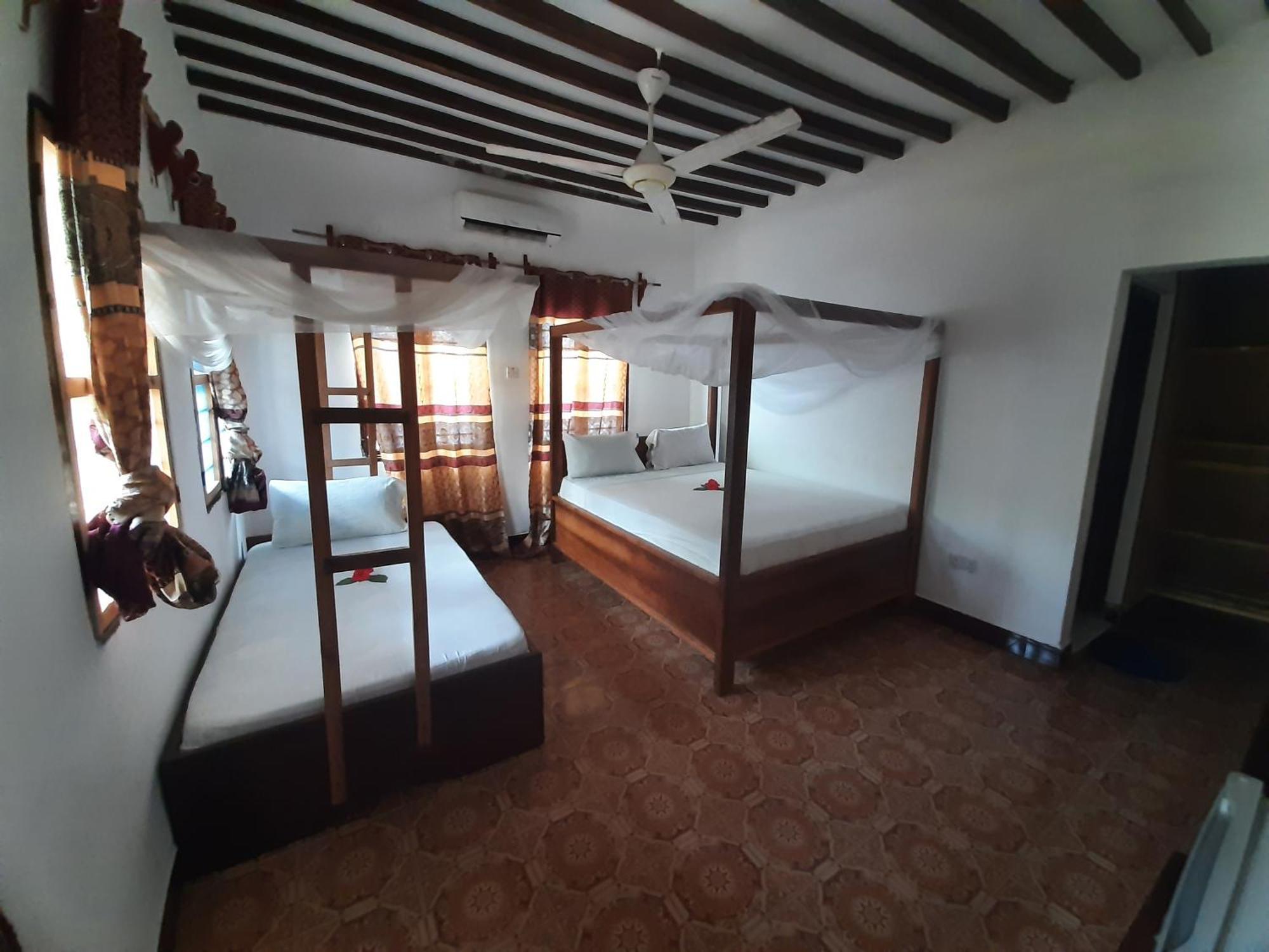 Ames Nungwi Quarto foto