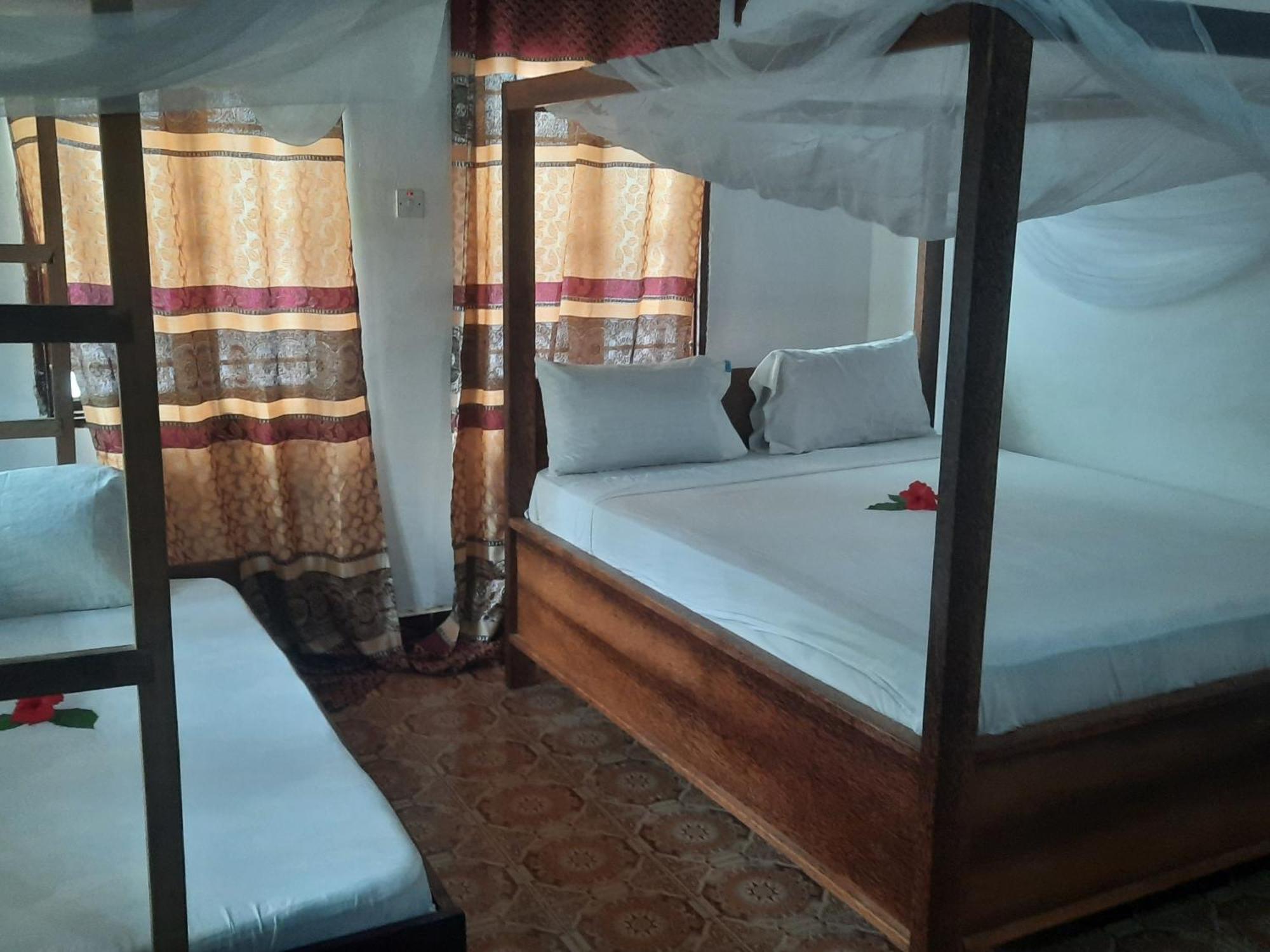 Ames Nungwi Quarto foto